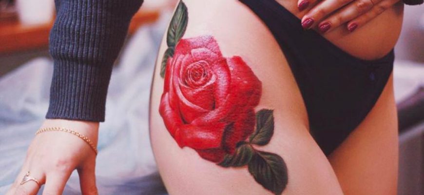 Татуировка розы на спине девушки